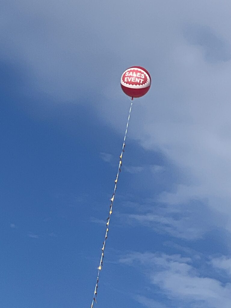 SALES EVENT Balloon with gold pennants.JPG